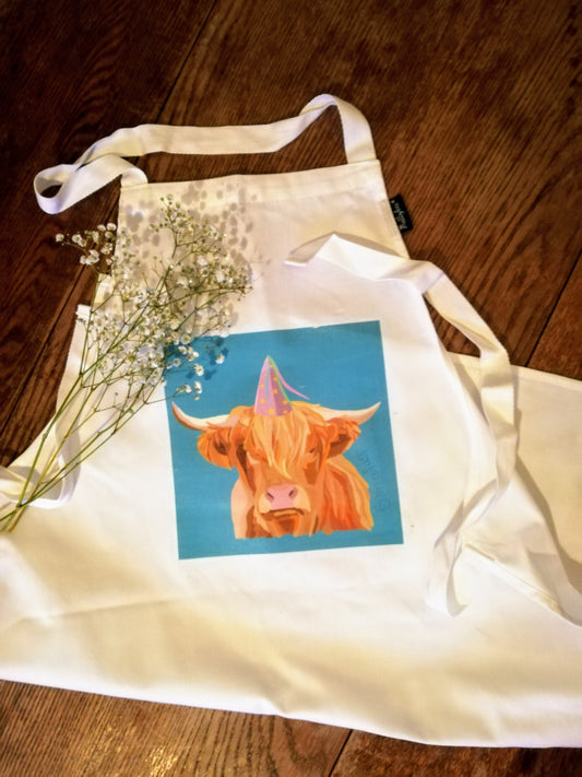 Highland Cow in party hat apron