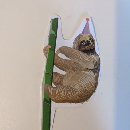 Sloth in a party hat sticker